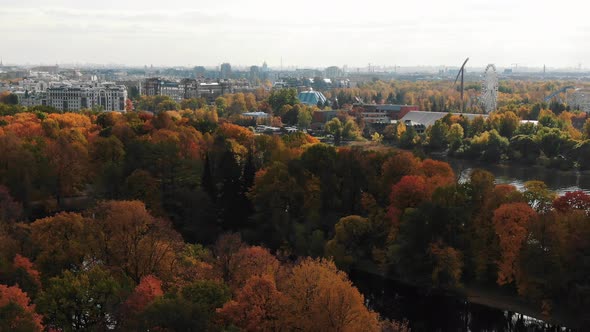 Large City Park with Long River on Gloomy Autumn Day