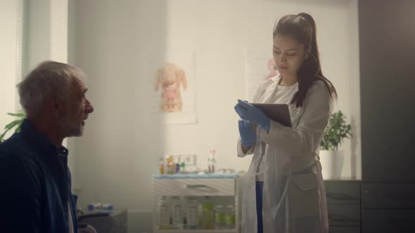 Physician Woman Testing Patient Using Tablet in Hospital Closeup