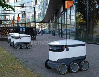 Autonomous delivery robot on street. Estonian company developing autonomous delivery vehicles. Conce