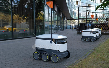 Autonomous delivery robot on street. Estonian company developing autonomous delivery vehicles. Conce