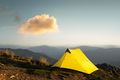 Yellow tent against the backdrop of an incredible mountain landscape - PhotoDune Item for Sale
