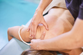 Massage therapist massaging female shoulders - PhotoDune Item for Sale