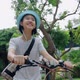 Beautiful Asian teenager girl having fun with riding a bicycle, Slow motion - VideoHive Item for Sale