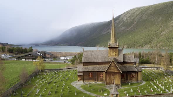 Exterior Of Lom Stave Church In Innlandet County, Norway - aerial drone shot