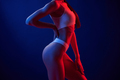 In dark room. Young woman in underwear is in the studio with neon lights - PhotoDune Item for Sale