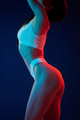 Diferent poses. Young woman in underwear is in the studio with neon lights - PhotoDune Item for Sale