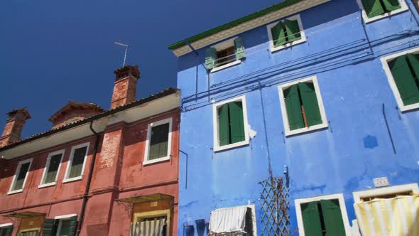 Old Shabby Multicolored Houses, Flowers Growing in Sunny Street, Burano Island