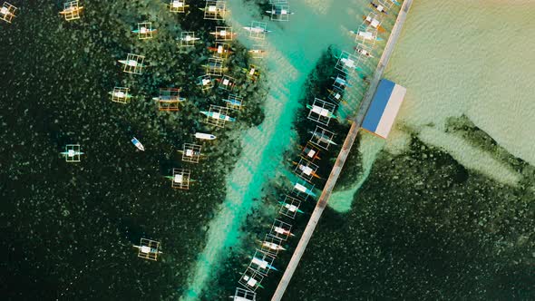 Pier with Boats in the Sea Aerial View