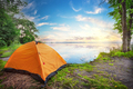 Orange tent by the lake at sunset - PhotoDune Item for Sale