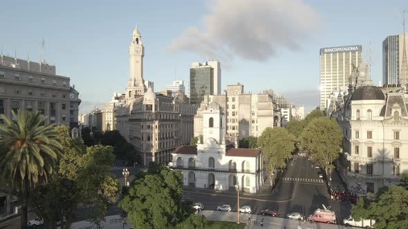 Aerial Drone flying back Cabildo building revealing Buenos Aires cityscape, Argentina. May Square, F