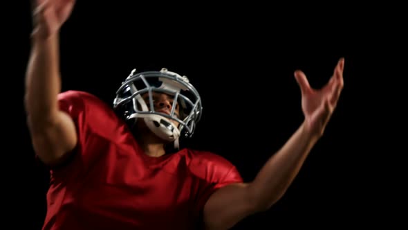 American football player catching the ball 4k