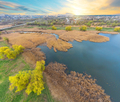 View of river and green bank from height at sunset - PhotoDune Item for Sale