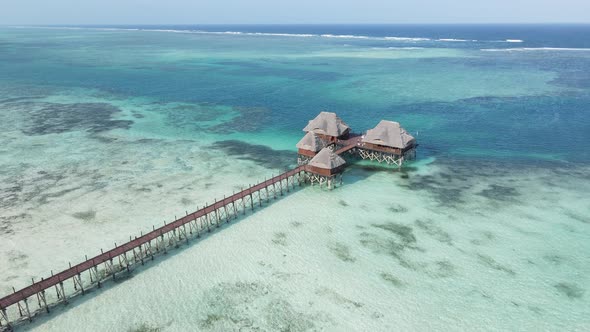 Aerial View of a House on Stilts in the Ocean on the Coast of Zanzibar Tanzania Slow Motion