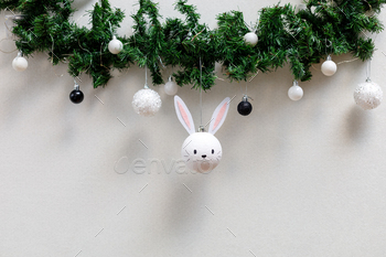  hanging on the christmas tree. Happy Chinese new year of the rabbit zodiac sign. Symbol of the year 2023.
