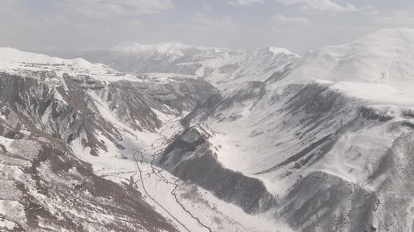 Gudauri, Georgia - April 12, 2021: Aerial view of Russia–Georgia Friendship Monument