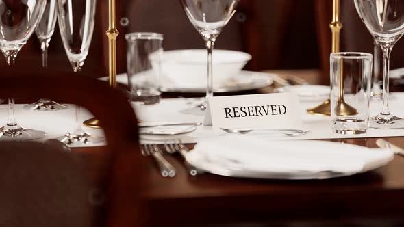 Reserved table card closeup. Animation of elegant tableware at a restaurant.