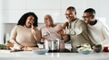 Happy Hispanic family having fun cooking together in modern kitchen - Food and parents unity concept - PhotoDune Item for Sale