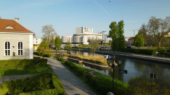 River Brda In The Polish City Of Bydgoszcz With Opera Nova In Poland. Approach Shot