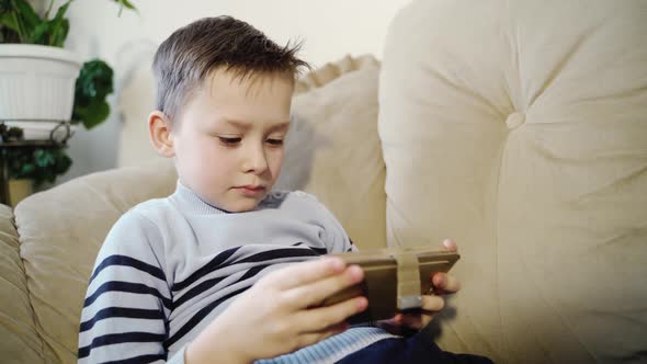 Little boy playing tablet game. Technology and lifestyle concept