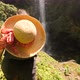 Young Traveler Girl Walking To Amazing Rainforest Jungle Waterfall and Raising Hands Up - VideoHive Item for Sale