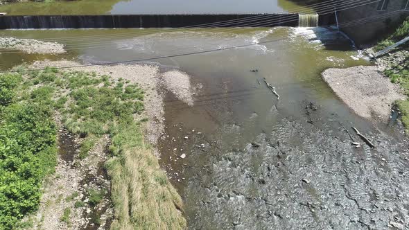 Aerial View of a Creek and Dam in Countryside