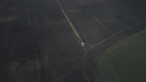 Aerial drone view drip irrigation watering system in agricultural farm field