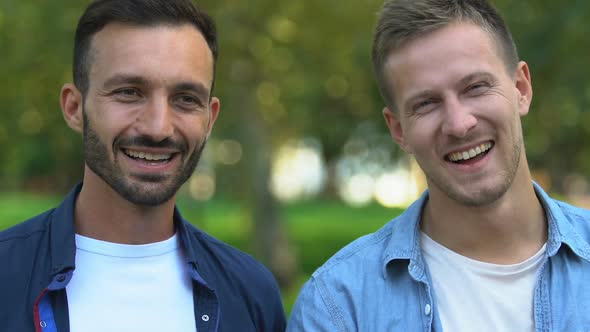 Cheerful Buddies Laughing, Hugging Before Camera, True Male Friendship, Close-Up