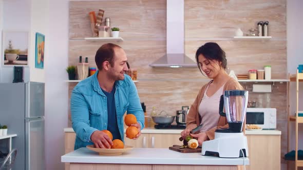 Man Joggle with Oranges