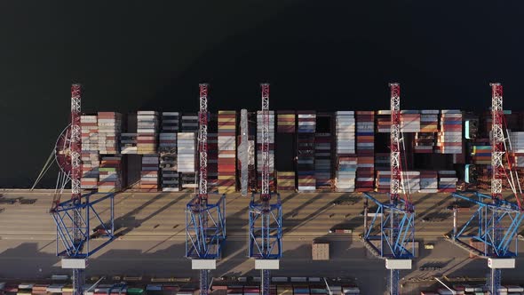 Cargo Ship - Top View Of Container Ship Dock At Loading Area Of Container Port. - aerial