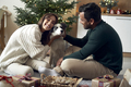 Caucasian man and latino man with dog spending Christmas together - PhotoDune Item for Sale