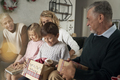 Multi generation caucasian family opening Christmas presents and having fun - PhotoDune Item for Sale