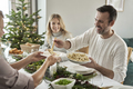 Caucasian man sharing ravioli at the Christmas Eve     - PhotoDune Item for Sale