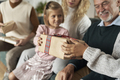 Multi generation caucasian family opening Christmas presents at home - PhotoDune Item for Sale