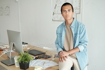 Photo realistic digital collage of young businessman sitting on table in office