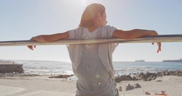 Young woman sitting on a beach