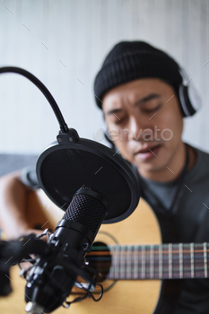 st in studio using microphone. People and music concept.