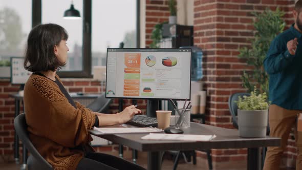 Stressed Employee Using Computer and Keyboard to Plan Project