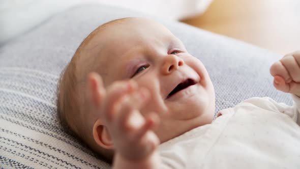 Closeup of Cheerful Cute Red Haired Baby