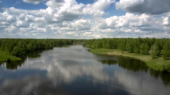 River at Green Dense Forests Against Driving Freight Train