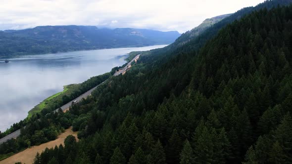 Aerial drone footage of Oregon with Columbia River, Phoca Rock, evergreen forest