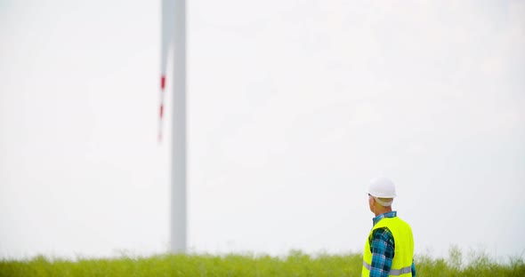 Engineer Using Digital Tablet at Windmill Farm