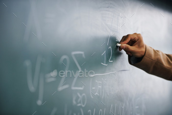 r writing a formula on a blackboard