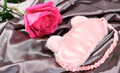 sleeping mask on a silk bedding sheet and pink rose, romantic evening concept, dating and love - PhotoDune Item for Sale