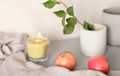 autumn aesthetic still life with apples and glowing candle. apple tree branch in concrete pot.  - PhotoDune Item for Sale