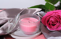Beautiful pink rose with aroma candle on luxury satin textile background. - PhotoDune Item for Sale