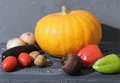 Autumn harvest organic pumpkin vegetables. garden grown Fresh organic veggies on dark wooden table. - PhotoDune Item for Sale