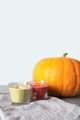 Scandi, minimal style. Cozy autumn still life.Halloween or Thanksgiving. Burning candles pumpkin  - PhotoDune Item for Sale
