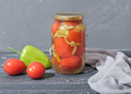 canned tomatoes and bell pepper preserves on wooden table. homemade autumn season vegetables - PhotoDune Item for Sale