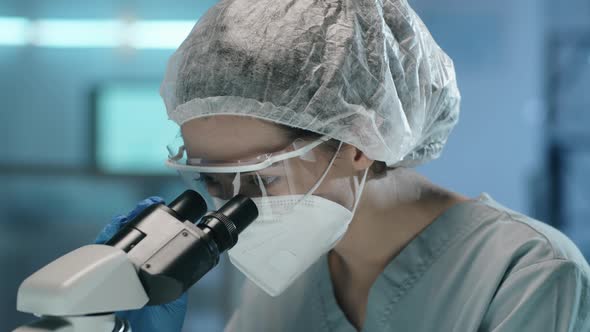 Portrait of Female Scientist in Protective Uniform at Work in Lab