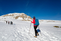 A woman walking on the snow in the mountains, - PhotoDune Item for Sale